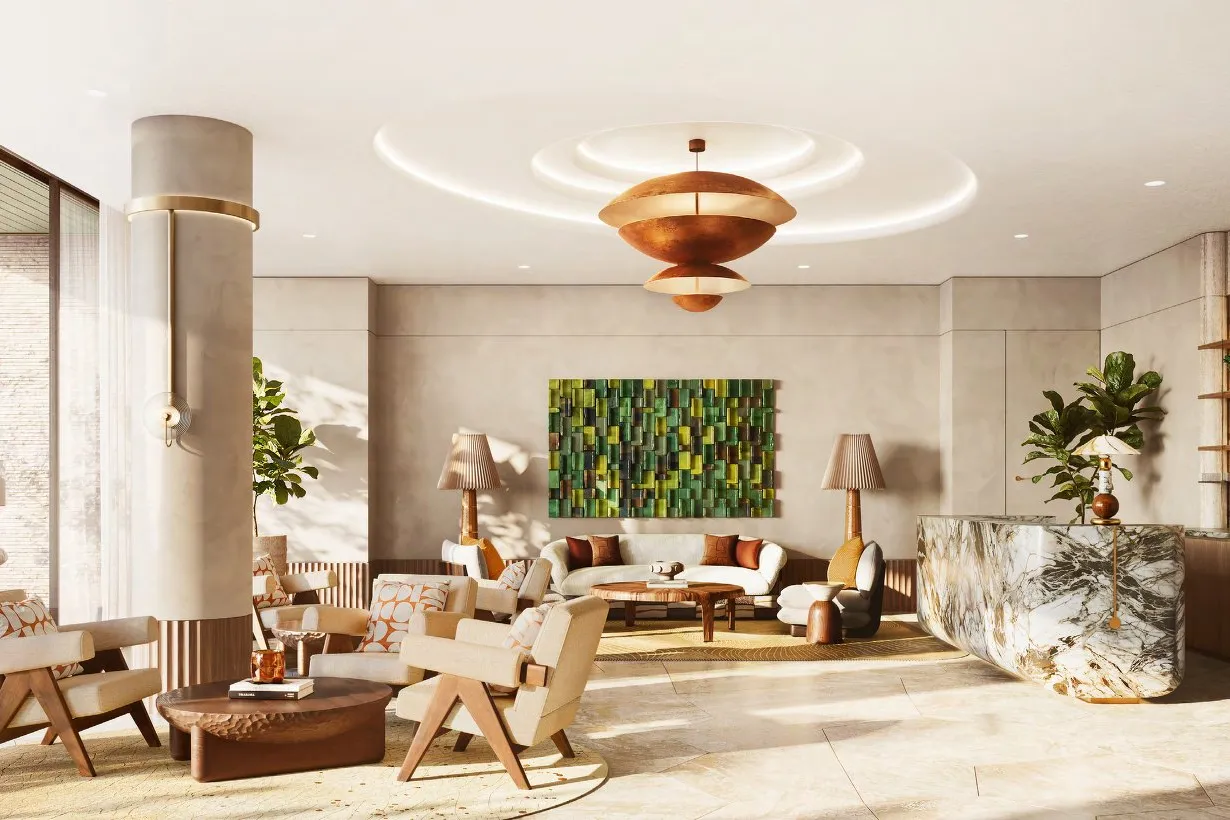 Residents' lounge with armchairs, marble bar and a terrace beyond