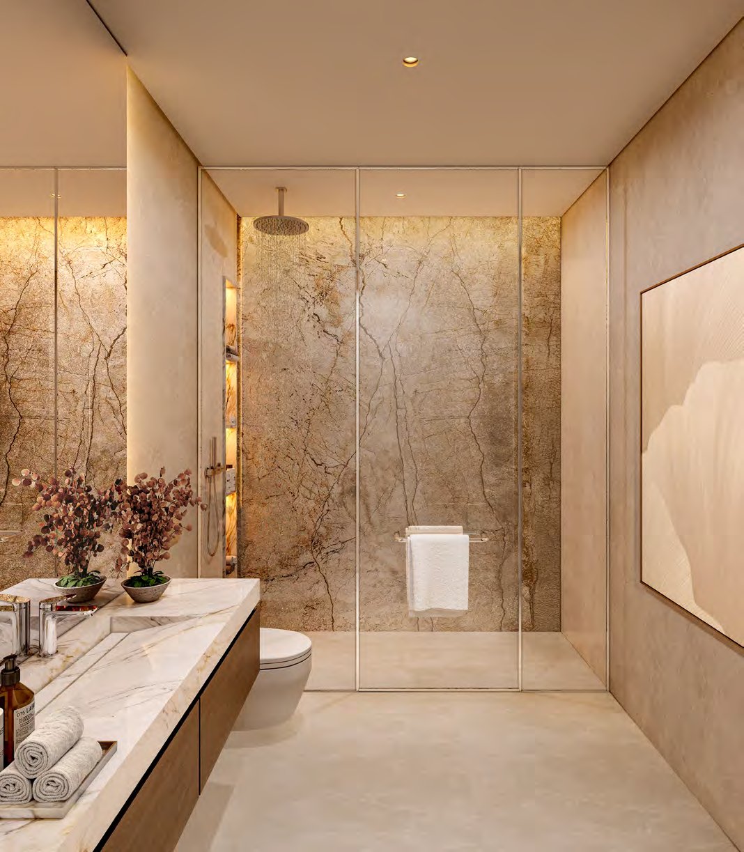 Bathroom with veined stone walls, walk-in shower and marble vanity