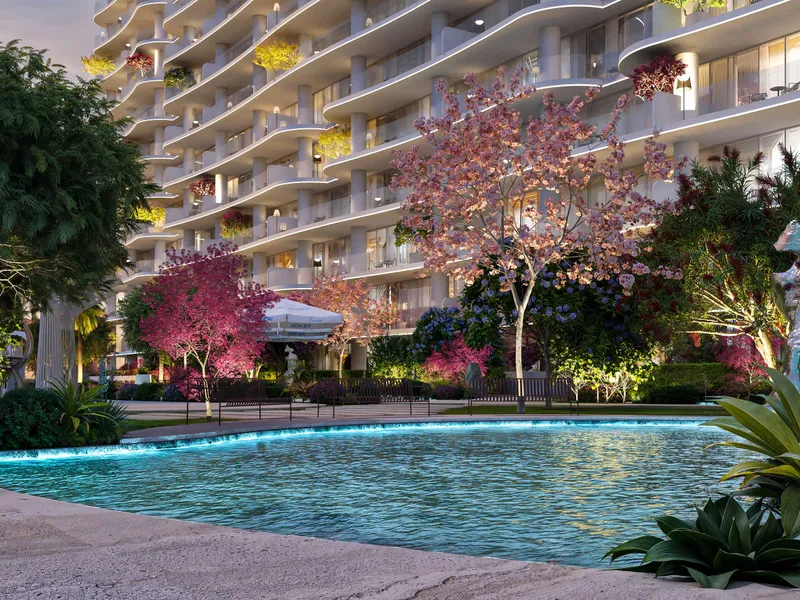 Curved turquoise pool with sunbeds and cabanas below the tower's wave-shaped balconies