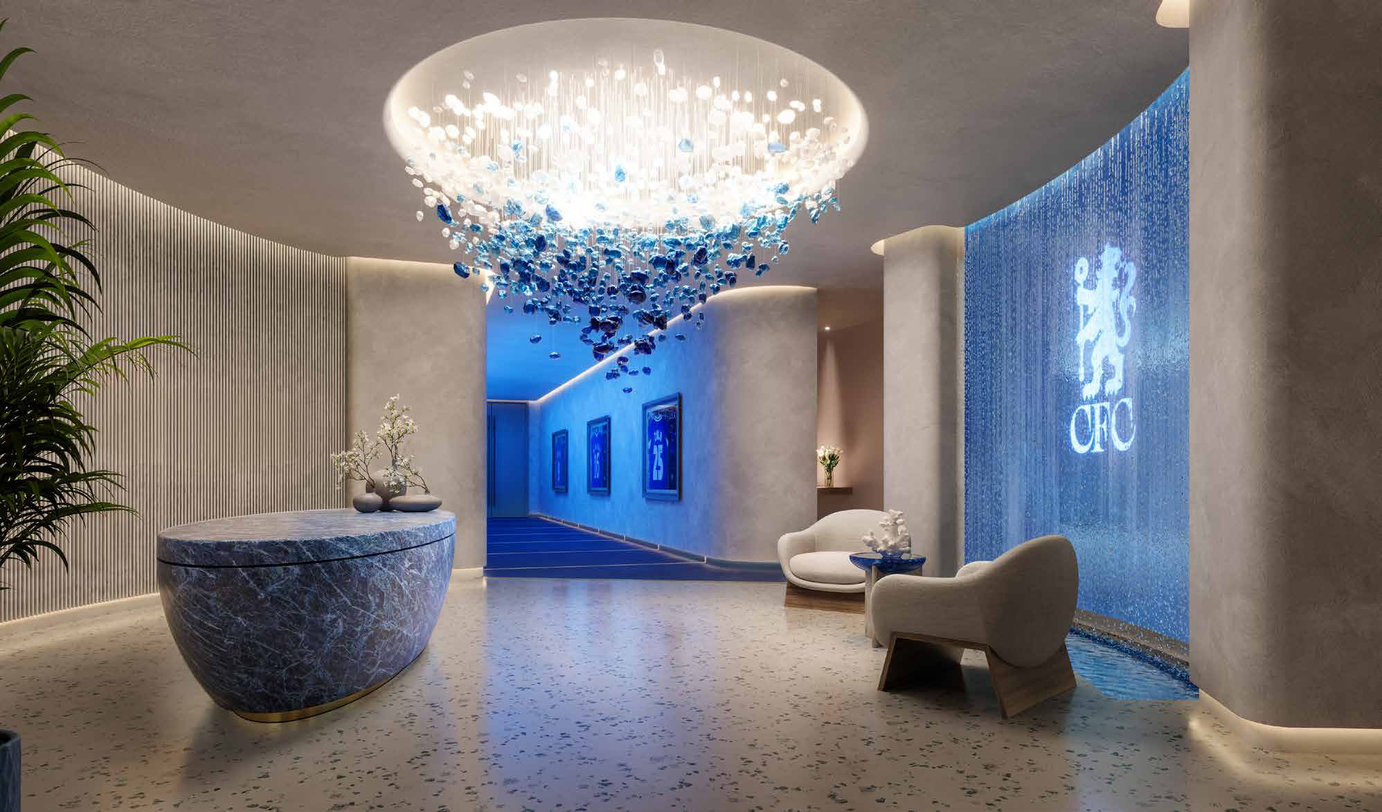 Spa reception with glass chandelier and a blue water wall