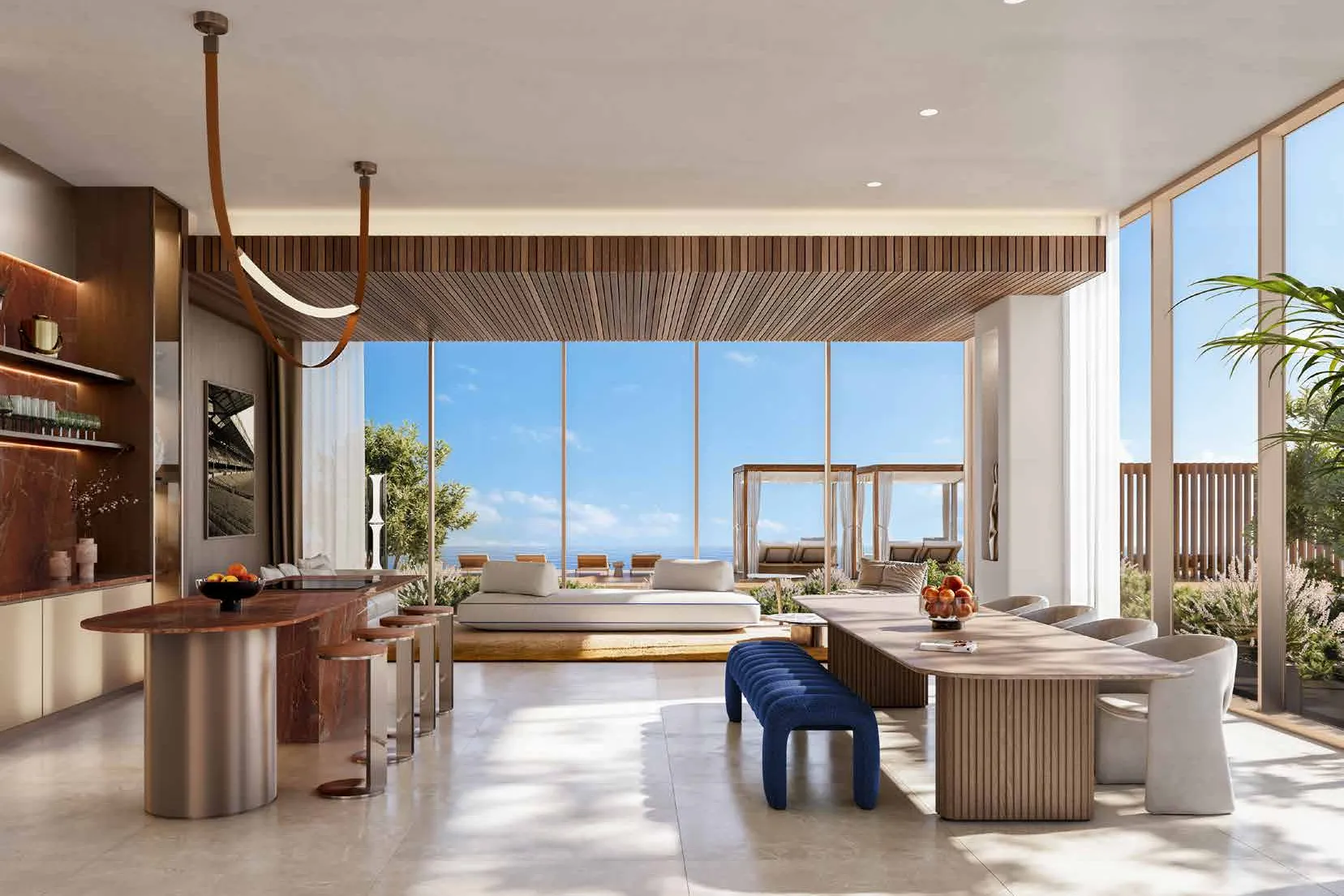 Sunlit dining room with long table, bar counter and terrace views