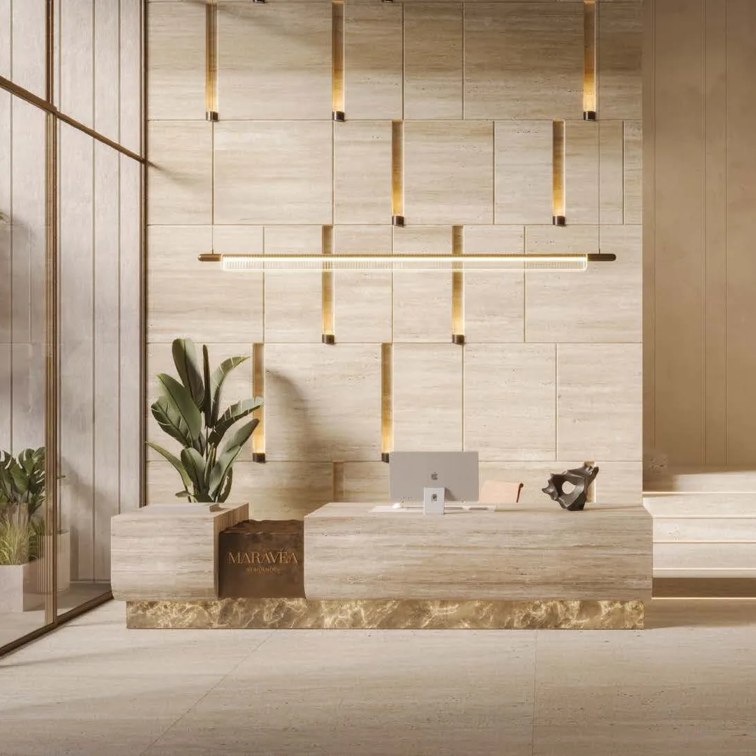 The double-height lobby in stone and warm wood