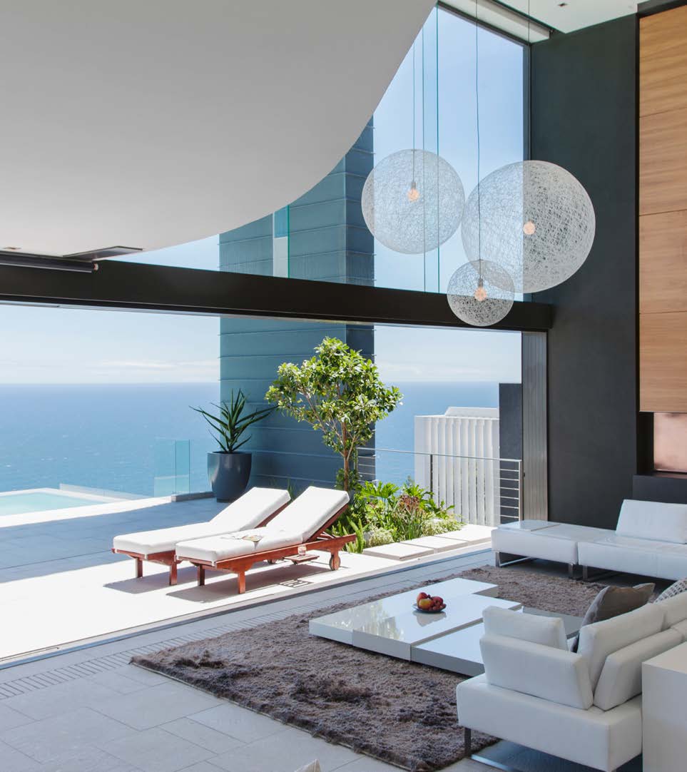 A terrace with loungers over a private pool